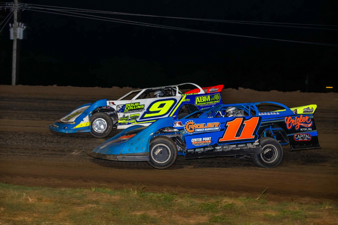 Sawyer Crigler (11) makes a move on the low side on his way to the late model win Sundat at CMS. Photo by Josh Allee.